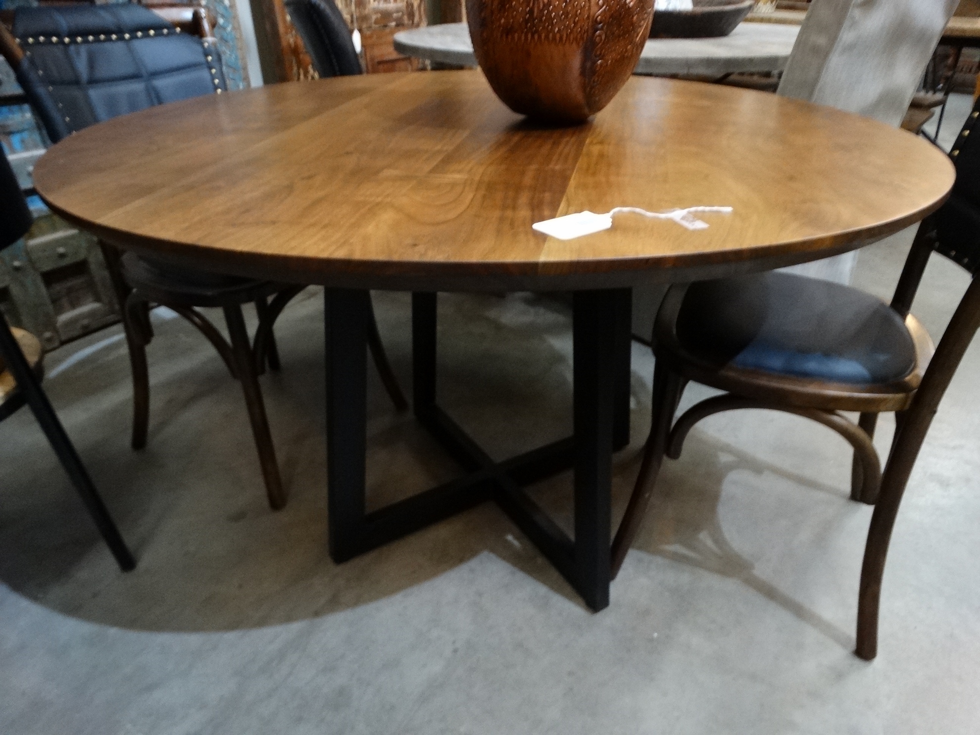 Black and brown round dining table Modern Wooden Dining Round Tablethis Farmhouse Table Has A Rich Brown Finish The Black Metal Base Contrasts Nicely The Black Iron Base Give It Industrial Appeal