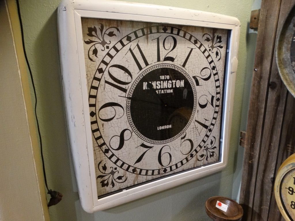 Square London Wall Clock Black and white clock says Kensington Station.