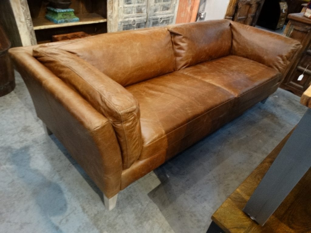 split leather on sides of sofa