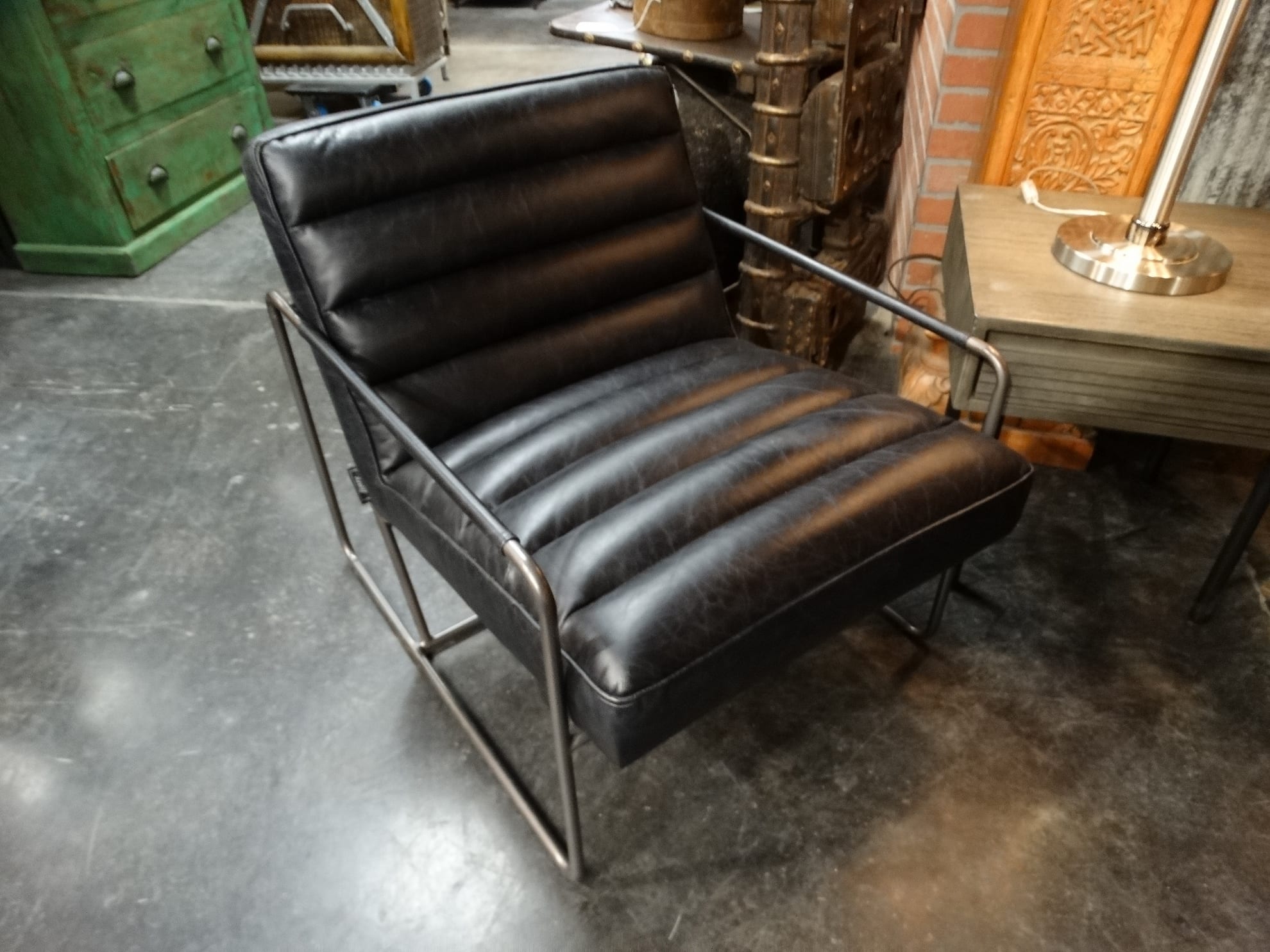 Elegant Black Leather Chair is roomy and has a classic flair.