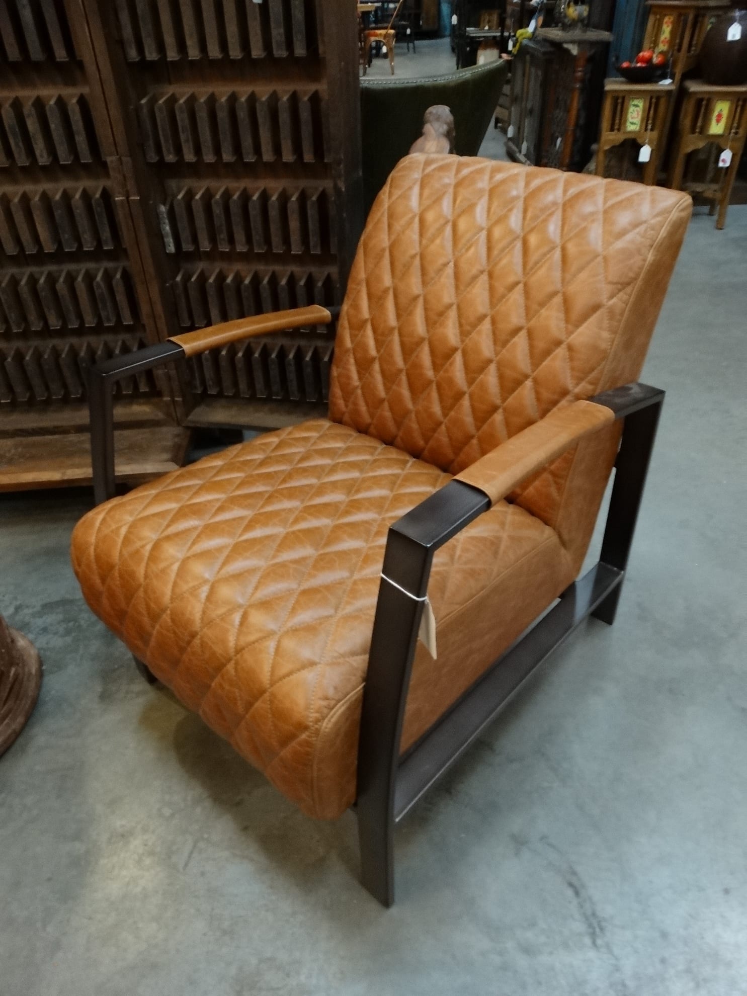 Elegant Leather Arm Chair has a traditional classic flair.