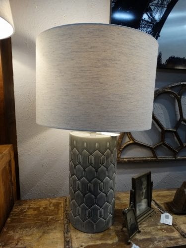 Decorative Table Lamp features a neutral shiny grey ...