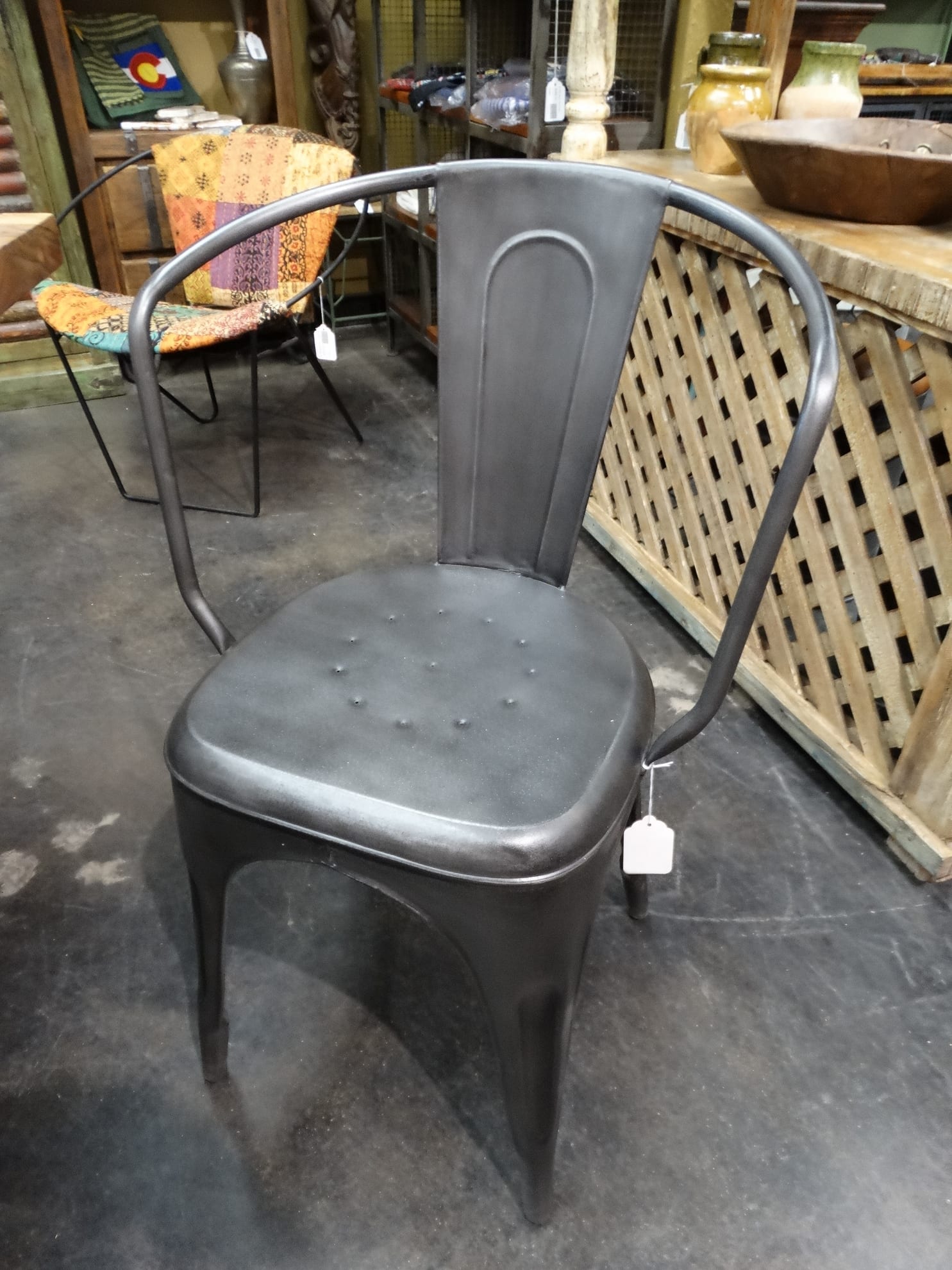 Metal Gray Chair with modern industrial charm features barreled back.