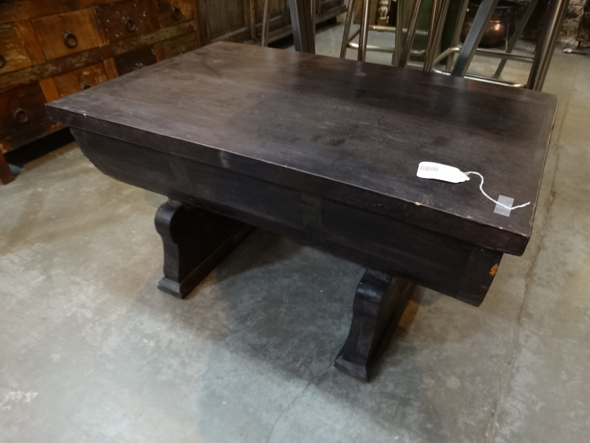 Wood Coffee Table Features A Dark Wood Half Barrel Storage Chest