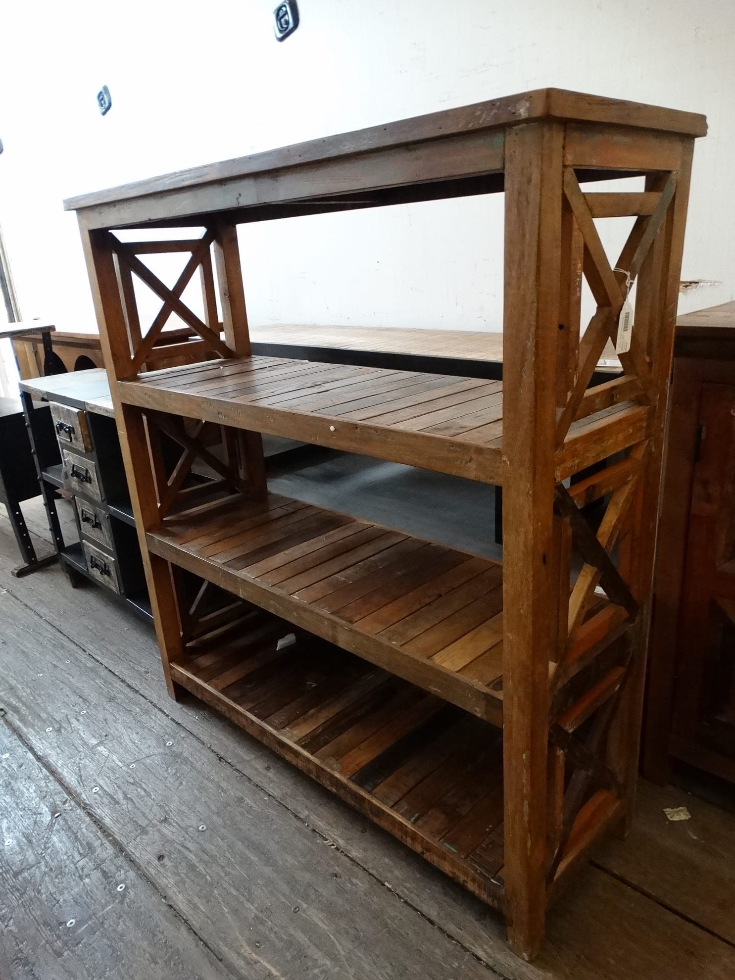 This shelf features 3 shelves and decorative X sides.