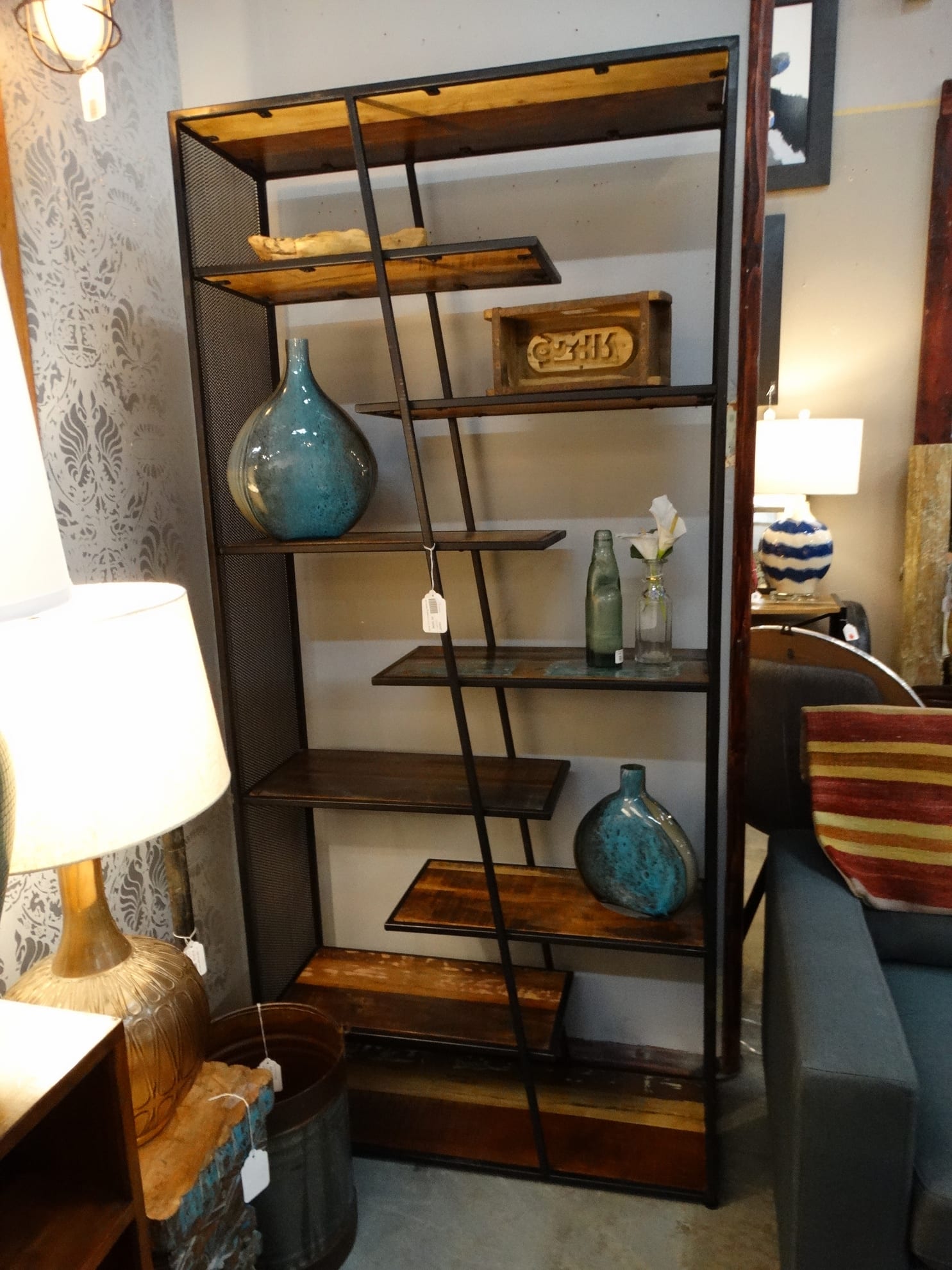 Wooden Open Shelf features wood shelves and a metal frame.