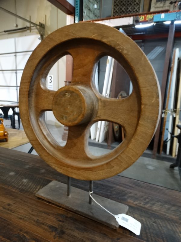 wooden round wheel hub on stand