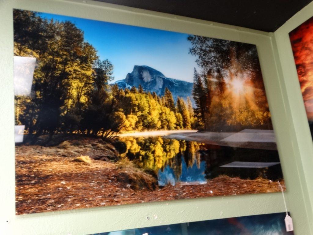 wall art glass behind photo mountain scene