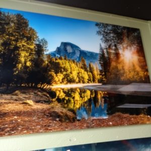 wall art glass behind photo mountain scene