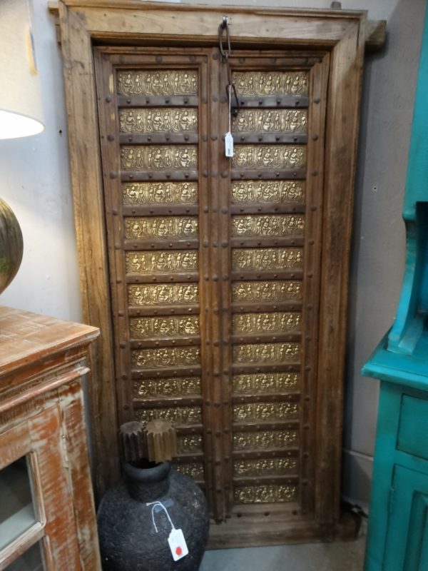 golden embossed metal art on antique door