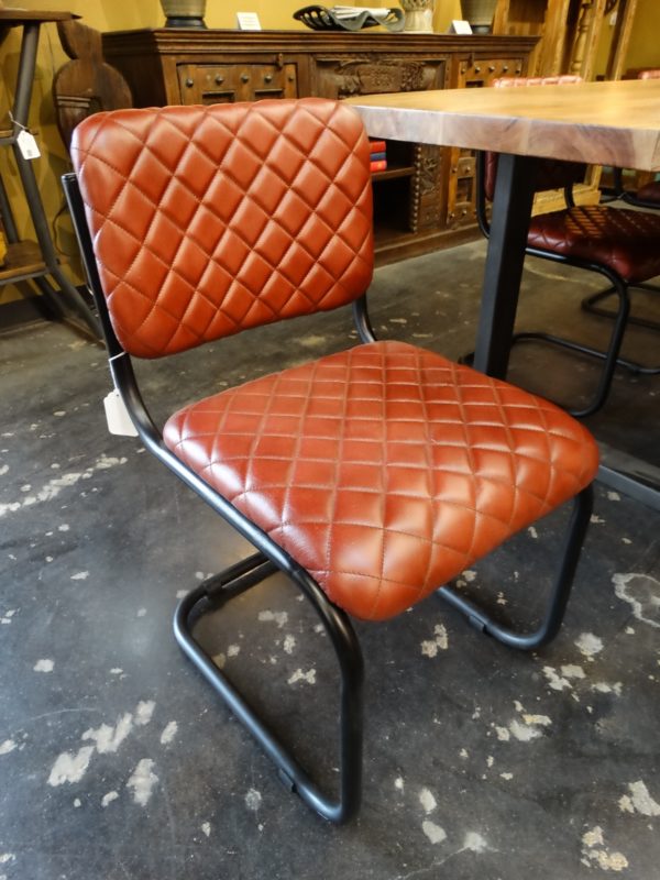 quilted red leather chair with metal base