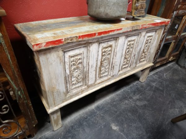 carved console table with storage trunk