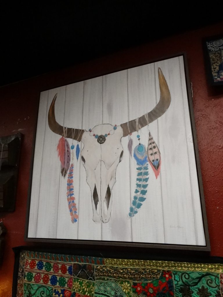 Wall Art Skull with Feathers on Rustic Background